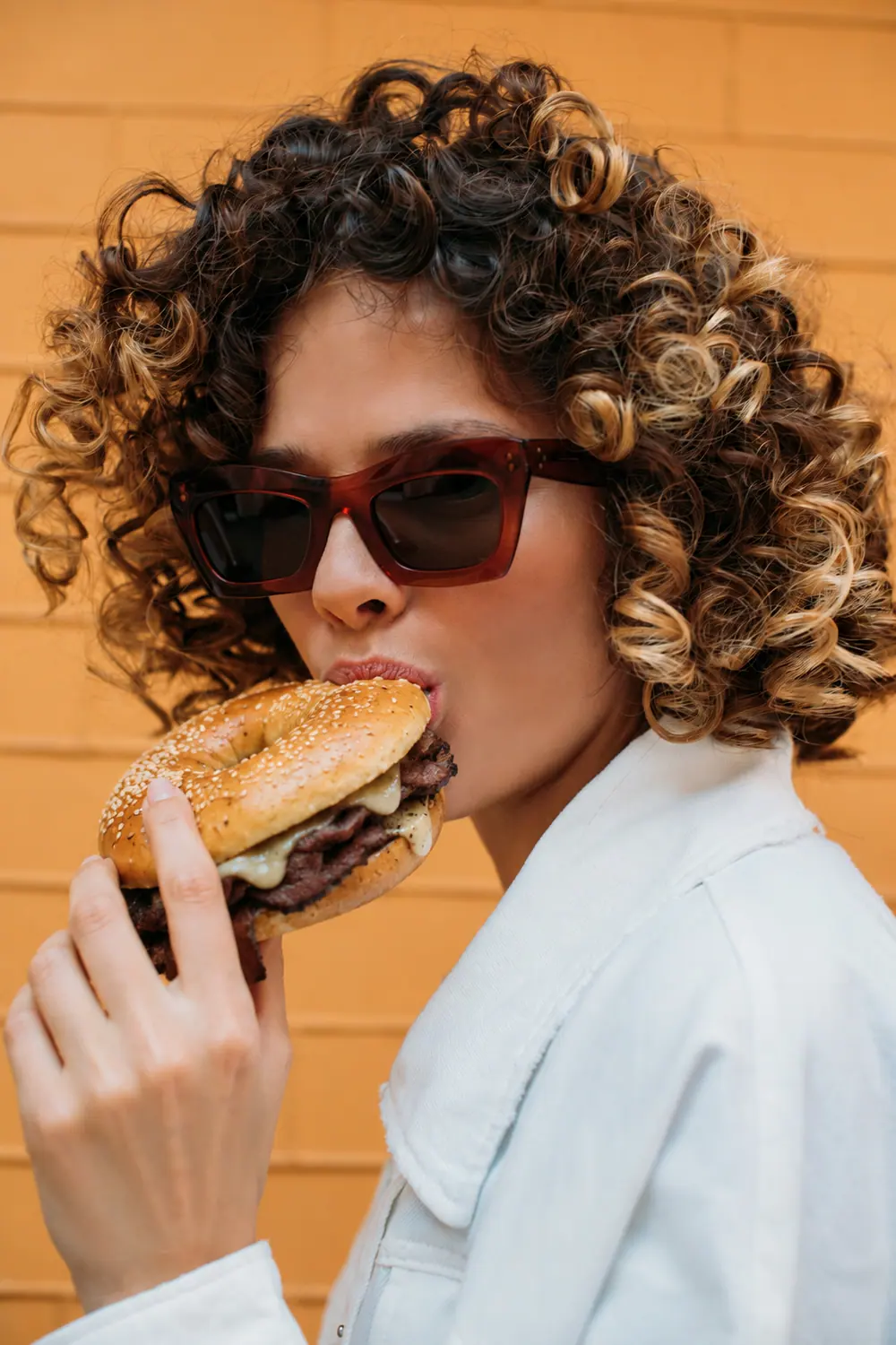 A regular enjoying a No.1 Princes St bagel