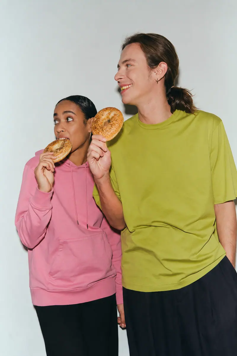 Two people enjoying bagels